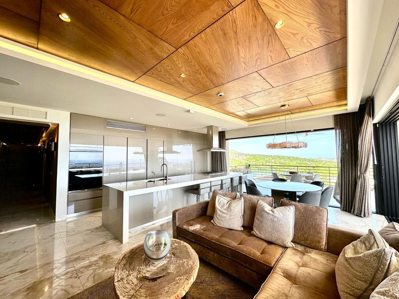 Living room and terrace with ocean view.