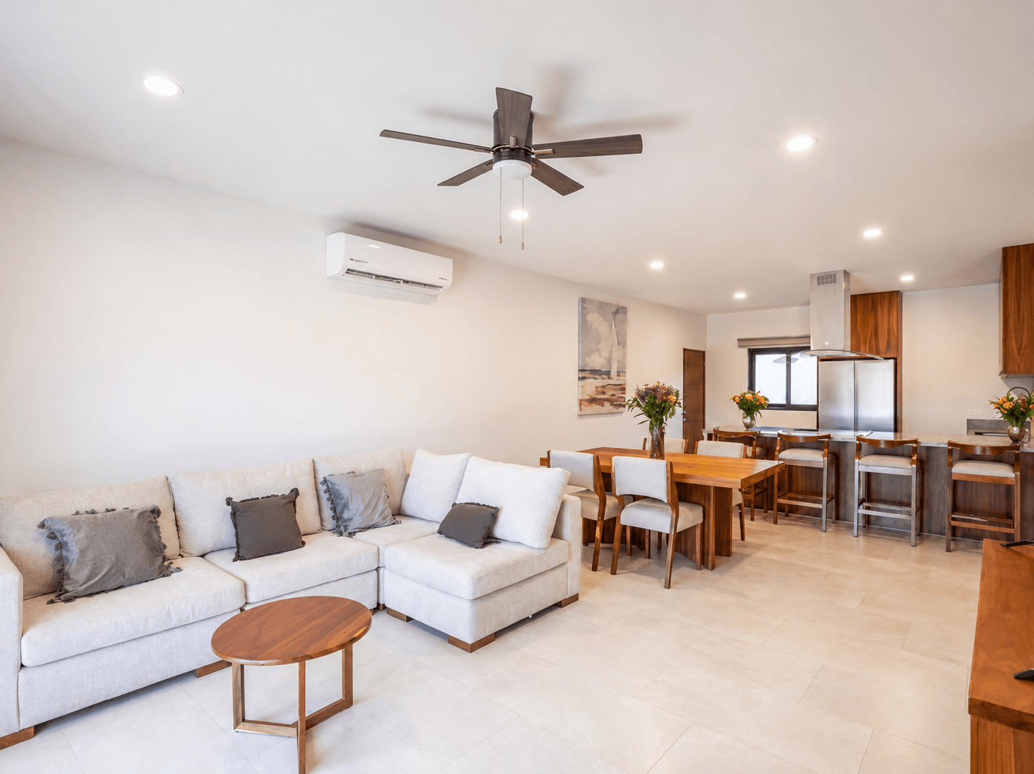 Contemporary living room with comfortable seating and open connection to the dining area.