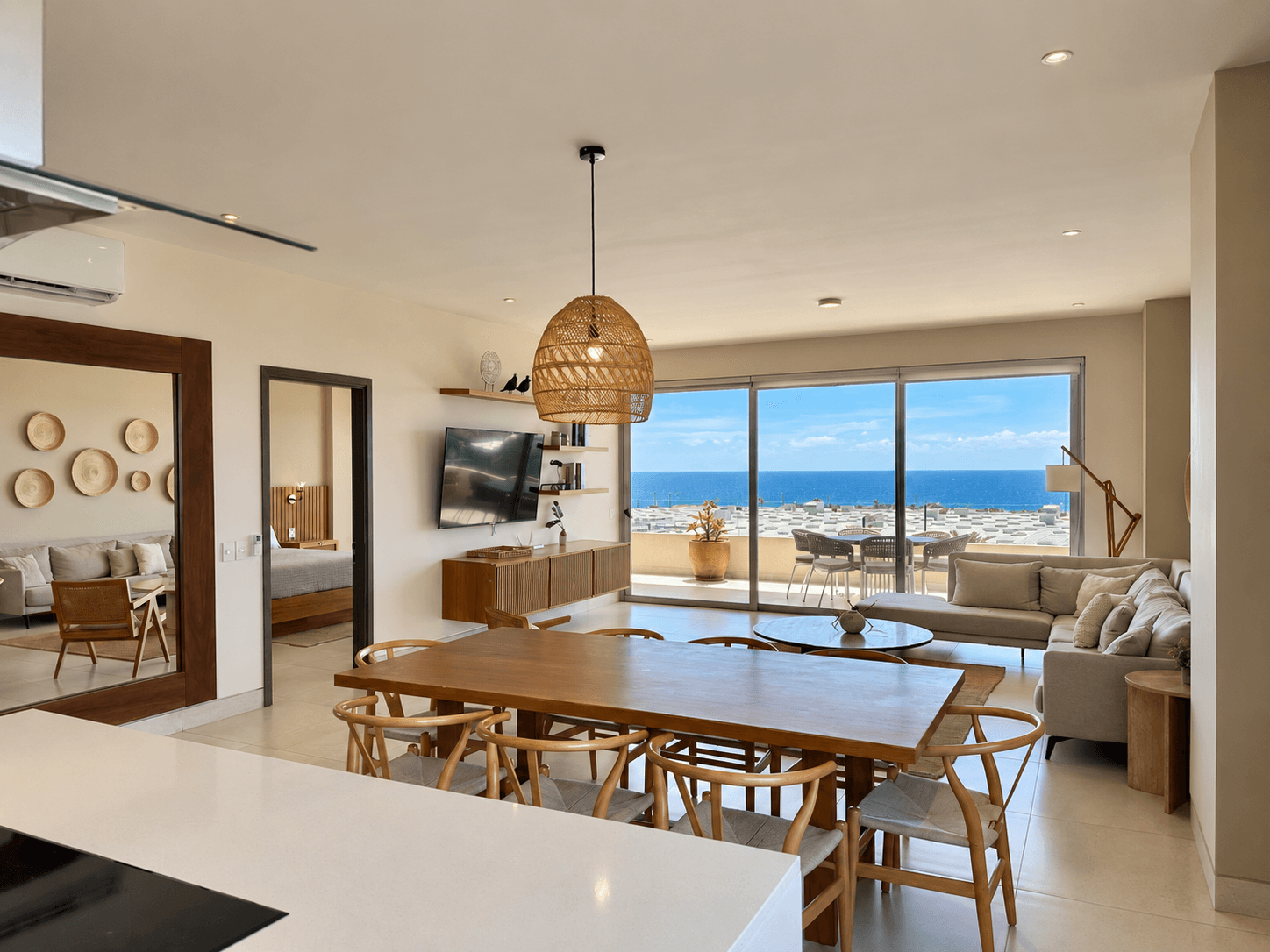 Living room, dining area and kitchen with Arch views.