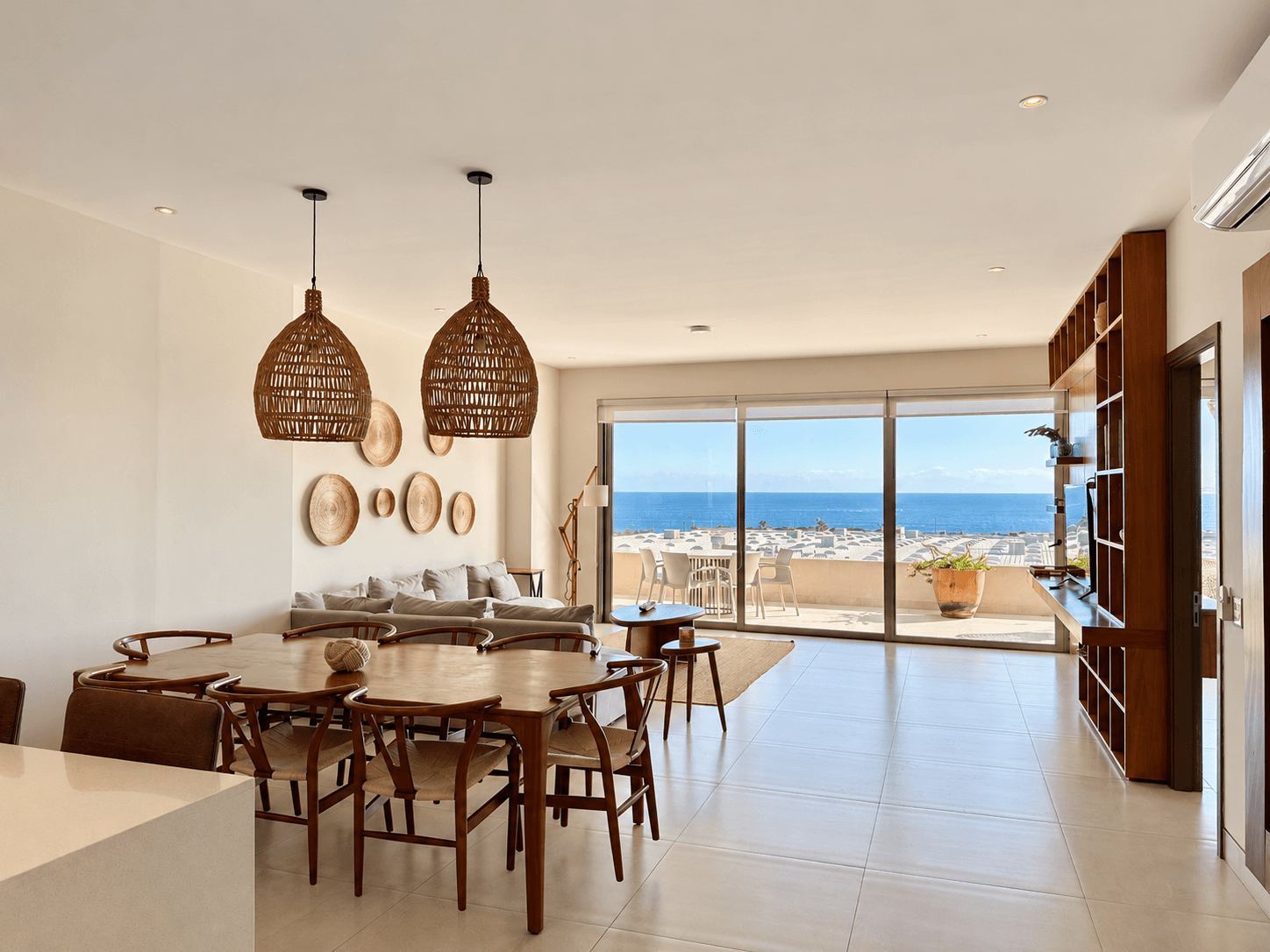 Open dining and living area with panoramic ocean views.