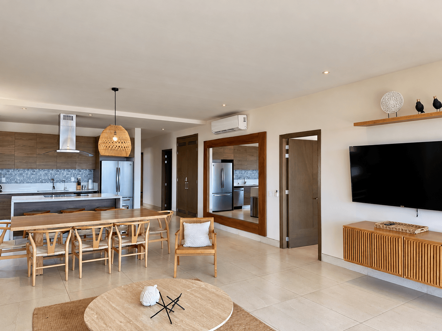 Living and dining area with wood finishes.
